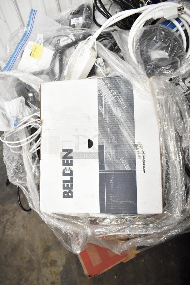 Pallet of cables including Belden 1700A and Paige cables in good condition, wrapped for auction, with visible brand markings.