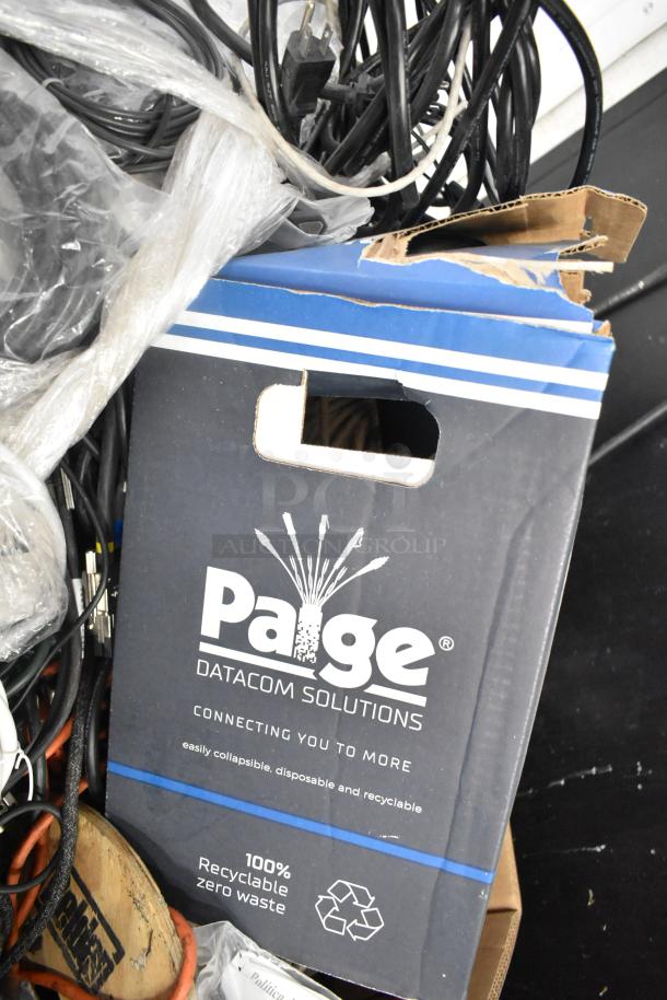 Pallet lot with Belden 1700A cable, Paige Datacom Solutions box, various wires. Box marked "100% Recyclable." Mixed condition.