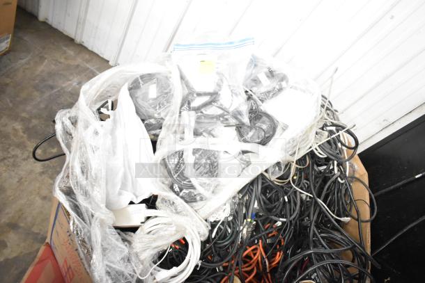 Pallet lot with assorted wires, including Belden 1700A cable and Paige cable, in used condition, wrapped in plastic.