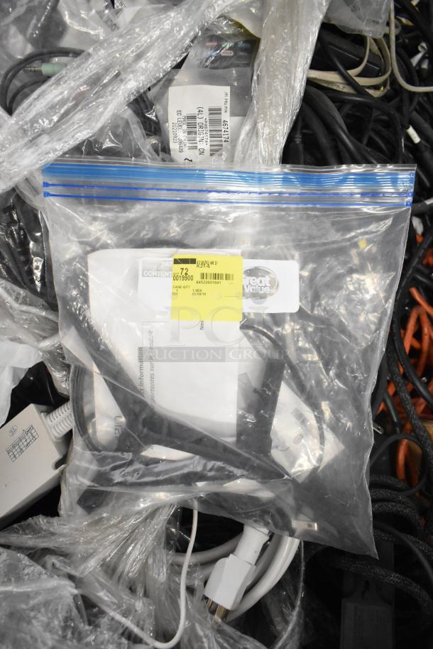 Pallet lot containing Belden 1700A cable, Paige cable, and various wires in mixed condition. Plastic-wrapped bundles with visible labels.