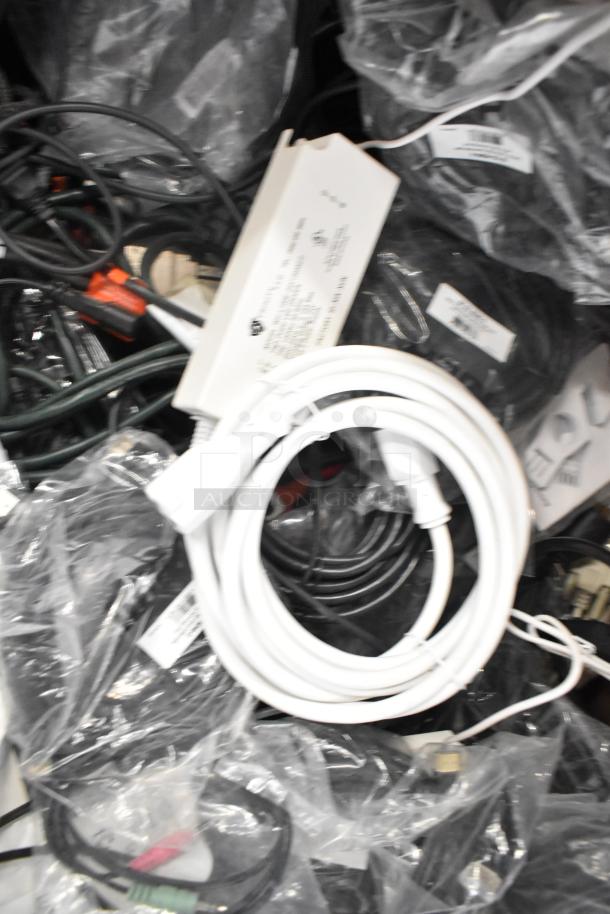 Assorted pallet lot including Belden 1700A cable, Paige cable, and various wires, in bulk packaging.