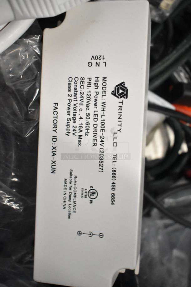 Pallet lot with Belden 1700A cable, Paige cable, wires, and a Trinity LLC WH-L100E-24V LED driver, model 203527, for auction.