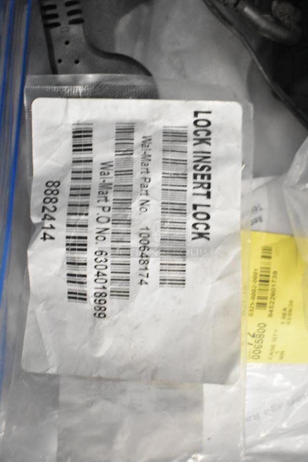 Pallet lot containing Belden 1700A cable and Paige cable. Labels include "Lock Insert Lock" and Walmart P.O. Number.