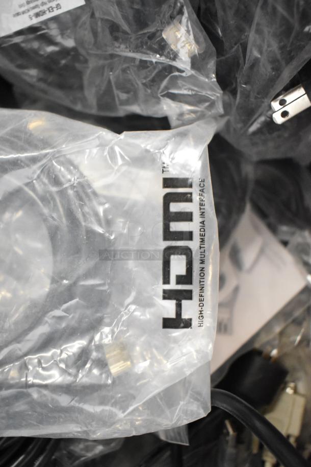 Pallet lot of cables, including Belden 1700A, Paige Cable, HDMI wires in packaging. Various connectors visible.