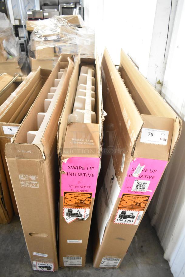 Three Samsung QM55C 55" televisions in original boxes with "Swipe Up Initiative" and cargo aircraft labels visible. Pick up only.