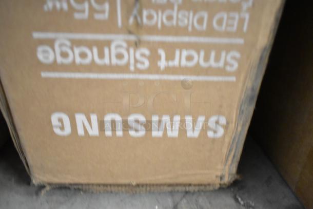 3 Samsung QM55C 55" TVs in original boxes, visible "Samsung" logo. Local pickup only.