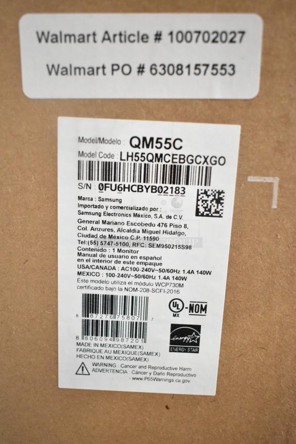Samsung QM55C 55" TV in original box, model LH55QMCEBGCXGO. Includes barcode, energy star label, and warning info. Pick up required.