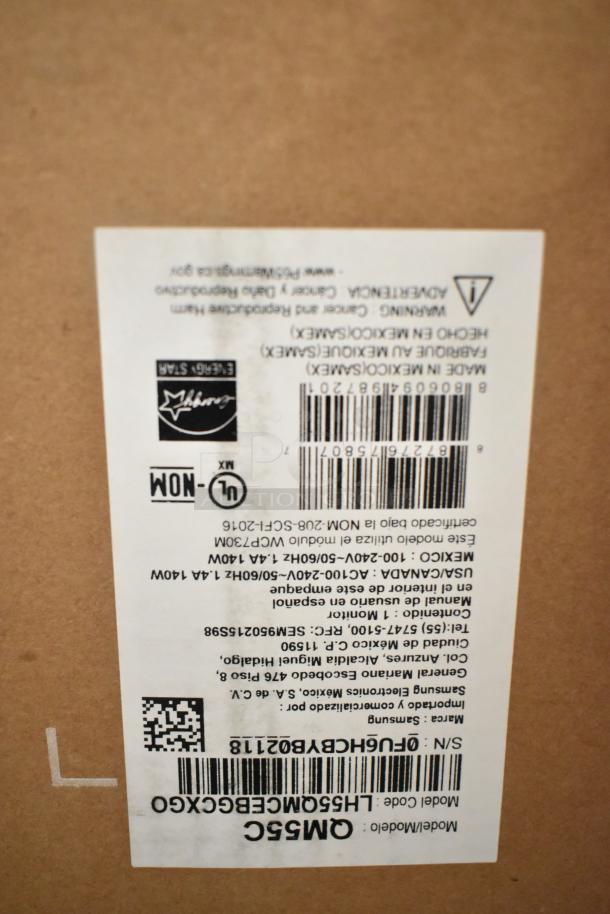 Samsung QM55C 55" TVs, 3 in original boxes, auction item, buyer pickup required. Model label and barcode visible on box.