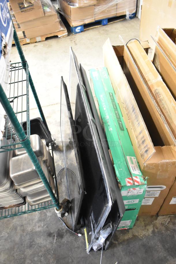 Four televisions including Vizio VFD40M-0804, Vizio VQD50S-0809, Philips 55PUL7552/F7, and Wren GVM43-0-3016-B, displayed for pickup only.