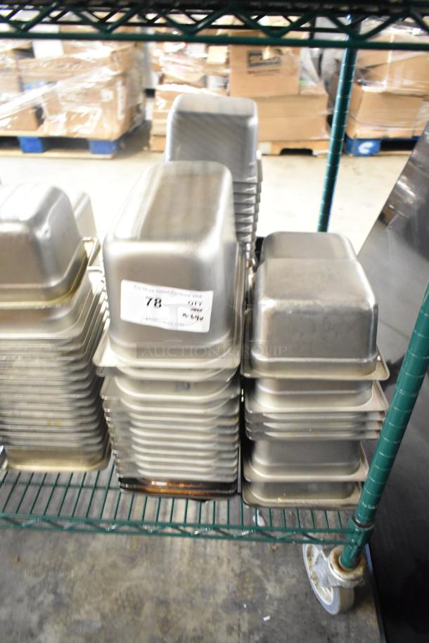 64 stainless steel drop-in bins, including 1/3 size, stacked on a rack. Auction tag indicating item number 78.