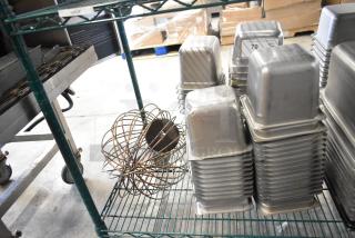 62 various items including a whisk attachment and 61 stainless steel drop-in bins, 1/6 size, stacked on shelves.