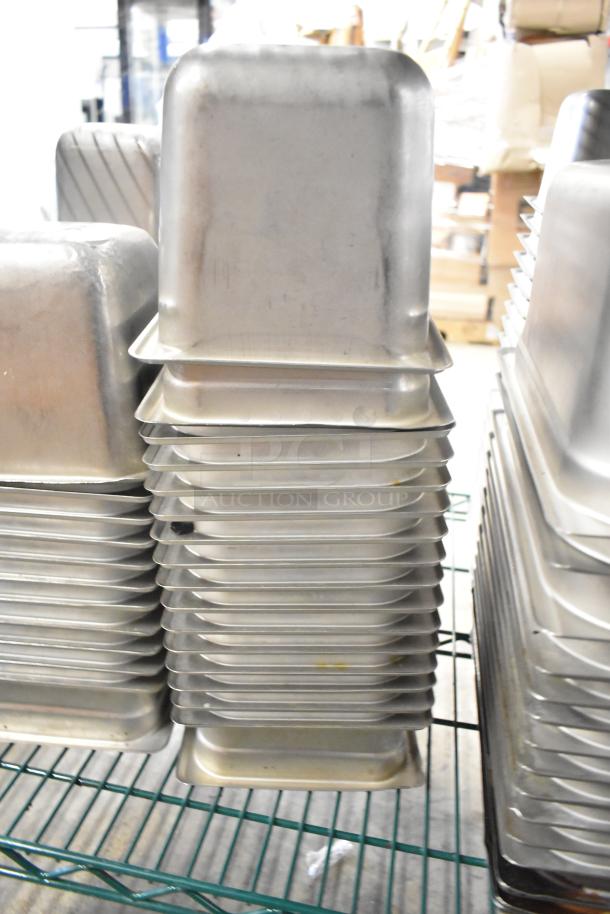 Stainless steel drop-in bins, stack of 1/6 size, pristine condition, 62-item auction including whisk attachment.