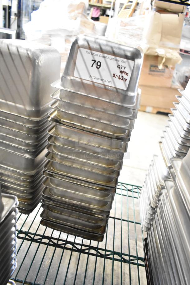 Stack of 61 stainless steel 1/6 size drop-in bins with auction label "79, QTY x-62V, PCIAuctions.com" on top bin.