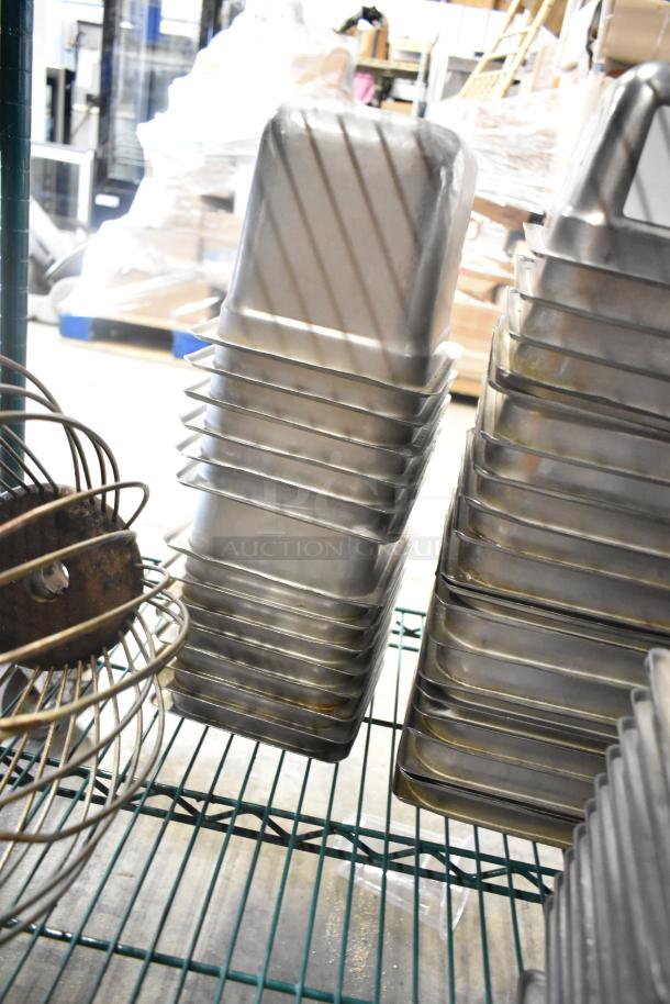 62 stainless steel drop-in bins, including 1/6 size, and whisk attachment for mixer on shelf. Items in good condition.