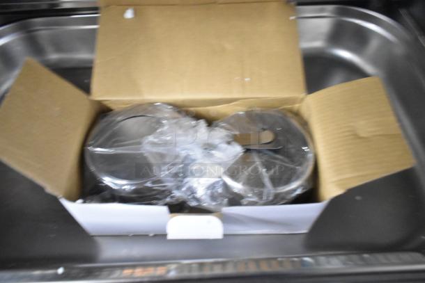 Countertop roll top chafing dish in new condition, packaged in a cardboard box with plastic wrapping.