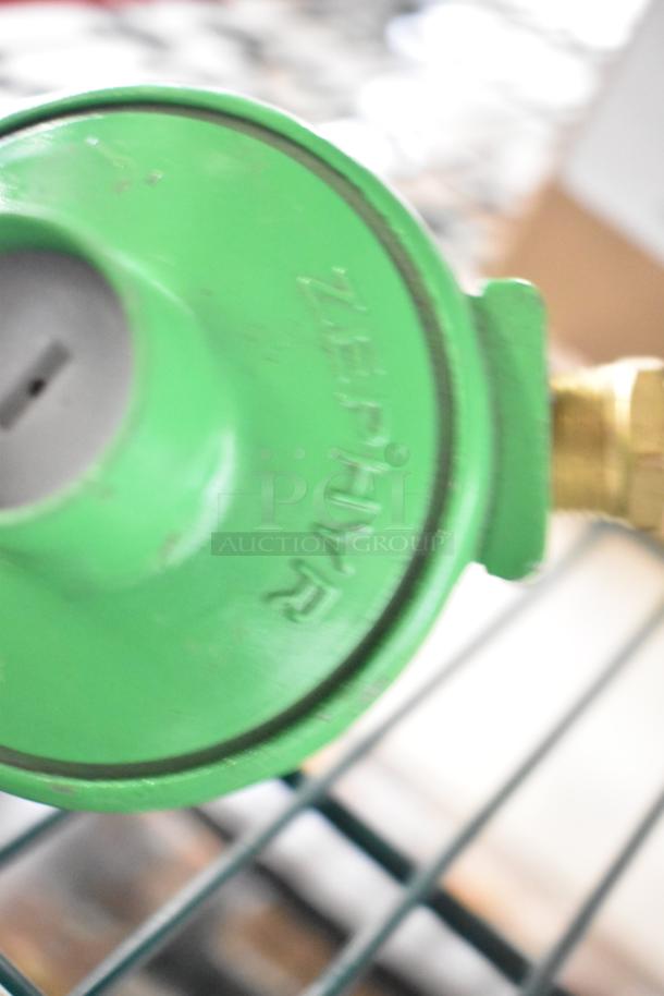 Green Zephyr component on shelving; part of a new Scratch and Dent bundle including Delfield evaporator coil, ticket rack, Watts valve.