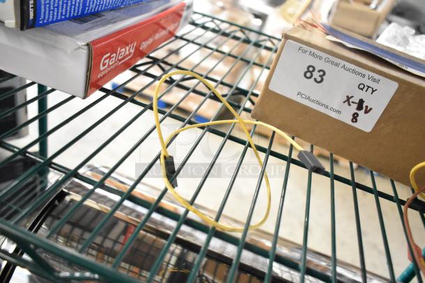 Eight brand new scratch and dent items including Delfield 3516298 coil evaporator, TR36 ticket rack, Watts safety relief valve.