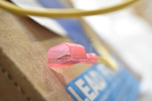 Auction items including Delfield coil evaporator, TR36 ticket rack, Watts safety valve, water pressure regulator, wires; brand new.