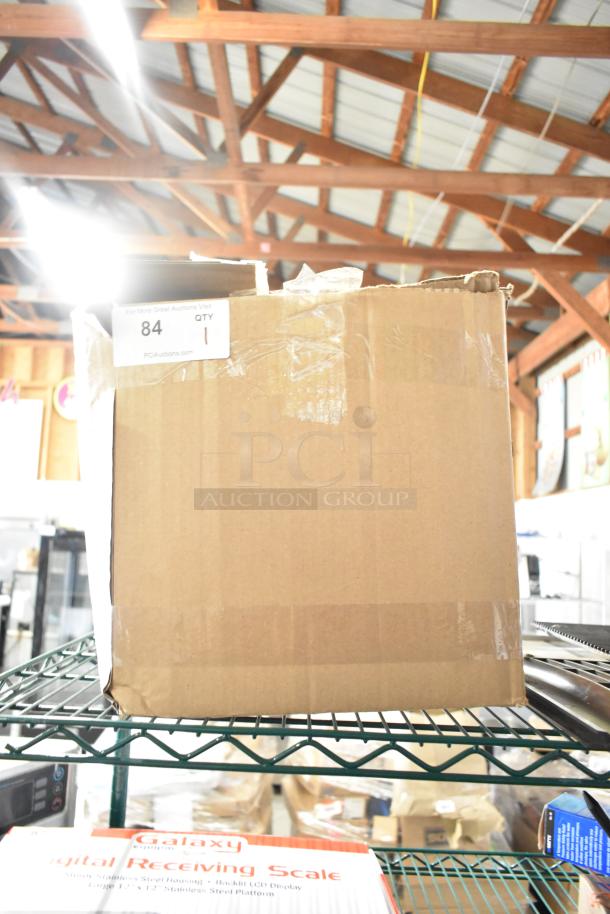 Boxed Embraco NEX4170UA Compressor, 115-127 Volts, 1 Phase. Brand new, scratch and dent condition. Auction label visible.