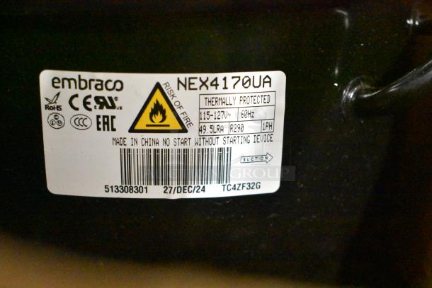 Brand new Embraco NEX4170UA Compressor, 115-127V, 1 phase, labeled thermally protected, risk of fire warning shown.