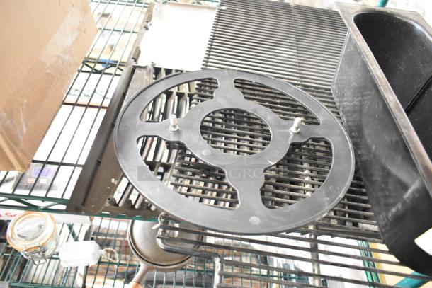 Assorted items on shelf: glass jar, blade sharpener, black bin, and ice head vent cover. Multiples of each.