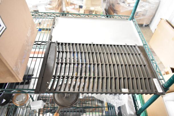 Assorted items including a glass jar, blade sharpener, metal bin, and ice head vent cover on a storage shelf.