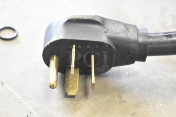 Close-up of a 3-prong power plug for a Turbochef HhC2020 commercial electric conveyor oven.