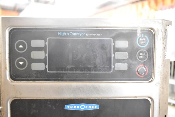 Turbochef HhC2020 commercial electric conveyor oven control panel, featuring power buttons and emergency stop.
