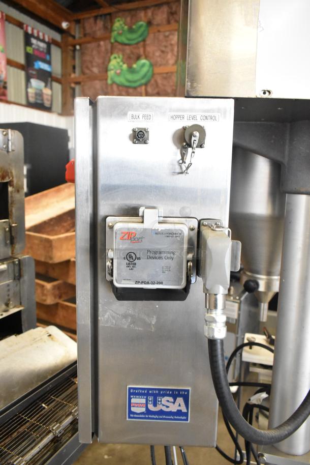 Per-fil Micro-15 commercial filler machine, features hopper control, bulk feed, and programming device panel, on casters.