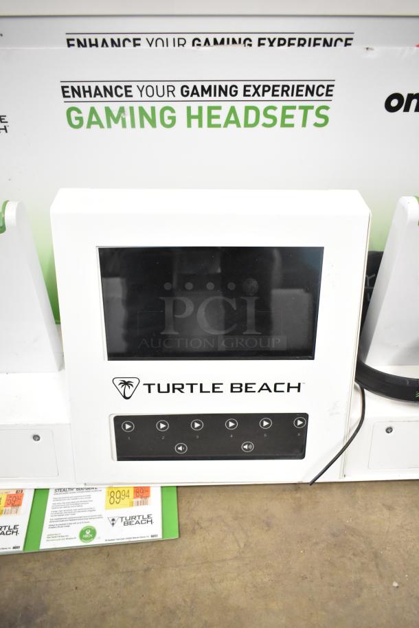 Turtle Beach gaming headset display featuring control panel and screen, promoting "Enhance Your Gaming Experience."