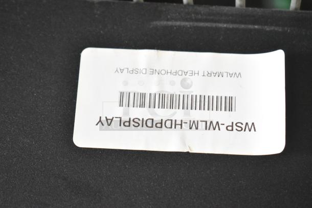 Label showing "Walmart Headphone Display" with barcode and item code WSP-WLM-HDPDISPLAY on black surface.