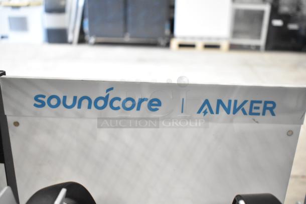 4 display stands with Anker Soundcore branding, featuring headphones. Good condition for promotional use.