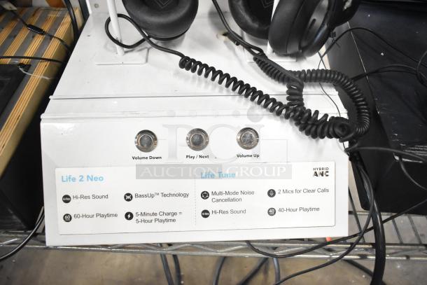 4 headphone display set with features like Hi-Res Sound, BassUp Technology, noise cancellation. Life 2 Neo and Life Tune models.