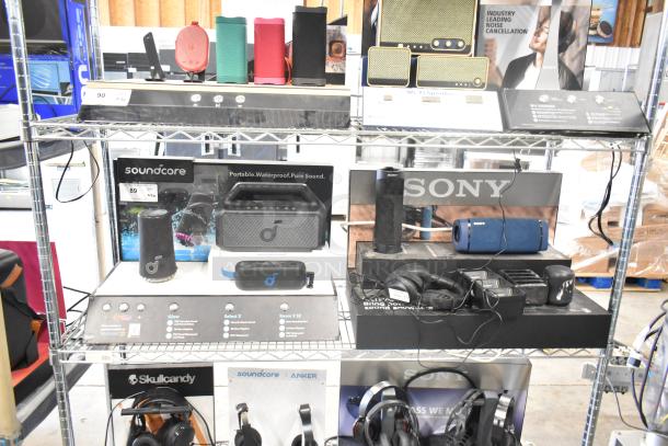 Store displays featuring Soundcore speaker with waterproof design and Sony speaker, showcasing noise cancellation.