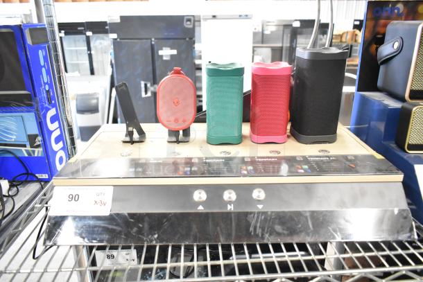 3 store display speakers: Sony headphones, Skull Candy in red and green, Onn in black. Includes display stand, good condition.