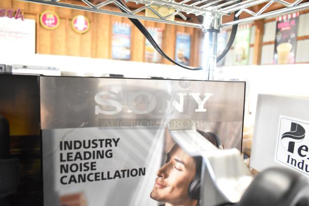 Sony store display for headphones, featuring industry-leading noise cancellation. Includes Skull Candy and Onn speaker displays.