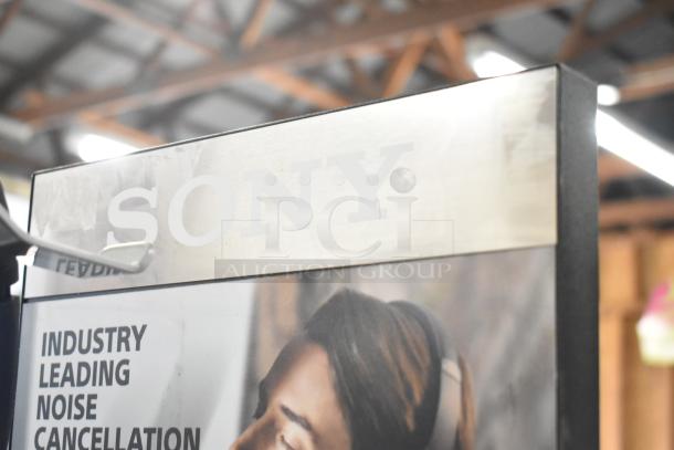 Sony store display sign highlighting industry-leading noise cancellation feature.