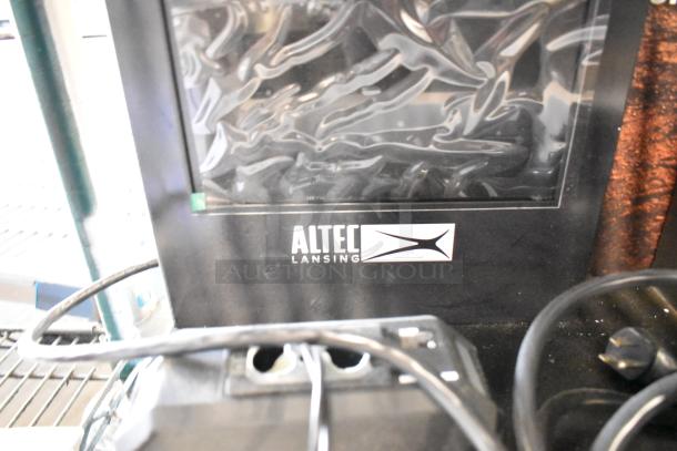 Altec Lansing store display for speakers, includes visible logo and wiring, part of auction lot with TonieBox and JBL displays.