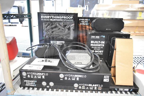 3 store displays: TonieBox, JBL speakers, Altec Lansing rugged Bluetooth speakers. Condition appears showroom-quality.