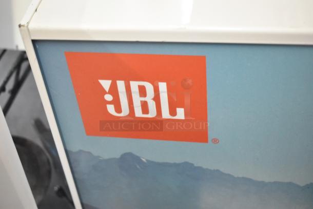 Store display featuring JBL speakers, highlighting iconic red logo and mountain design. Includes TonieBox 1, Altec speakers.