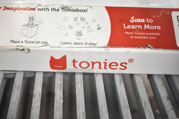 3 store displays featuring a TonieBox display. The box is used, with visible scuffs. Labels promote TonieBox features.