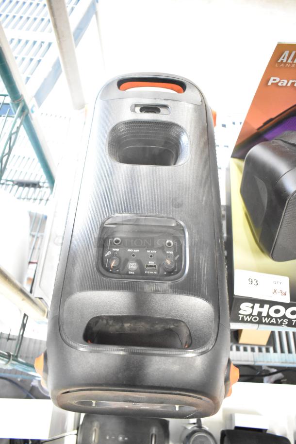 Three speakers including two JBL and one Altec model, in good condition, featuring control panels and connectivity ports.