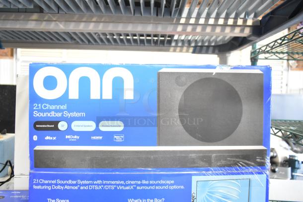 ONN 2.1 Channel Soundbar System store display with Dolby Atmos, DTS:X features; includes internal speakers and wireless subwoofer.
