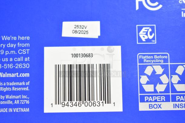 Close-up of product packaging with various labels and barcodes, indicating item details and recycling information.