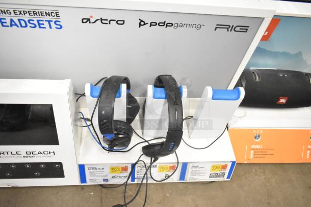 TonieBox 2s, Turtle Beach headphones, Sonos soundbar store displays. Includes packaging and labels with prices.