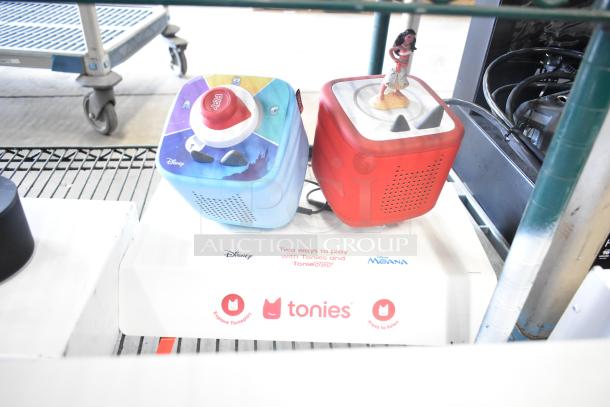 3 TonieBox 2s store displays featuring Disney and Moana themes, on a branded Tonies base, showcasing interactive play options.