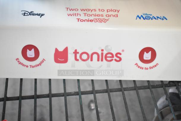 Display box for TonieBox 2s featuring Disney branding. "Explore Tonieplay" and "Press to listen" labels in red.