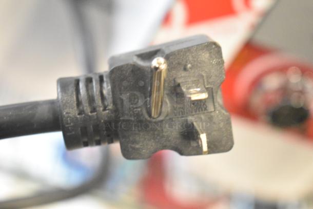 Close-up of a power plug for a BRAND NEW Avantco 184T140 Commercial Conveyor Toaster, 120V, 1 Phase.