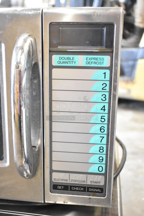 Sharp R-21LVF commercial microwave, stainless steel, keypad with numbered options, 120V, 1 phase, ideal for heavy use.