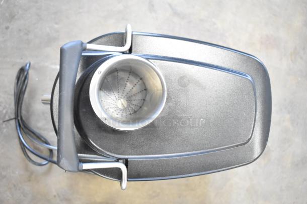 Ceado ES500 Commercial Countertop Juice Extractor, black finish, 110-120 volts, top view showing juicing chamber and power cord.